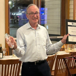 Brian Fontes Smiling with British APCO Life Time membership award